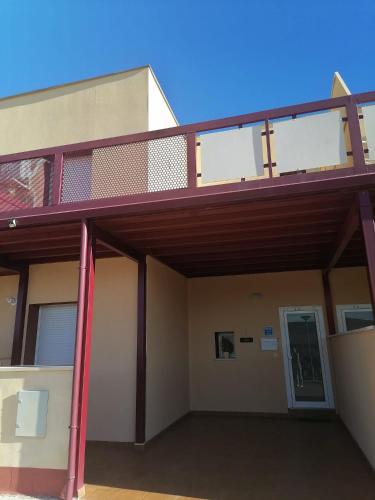 a building with a balcony on top of it at El Vergel del Piedra in Munébrega