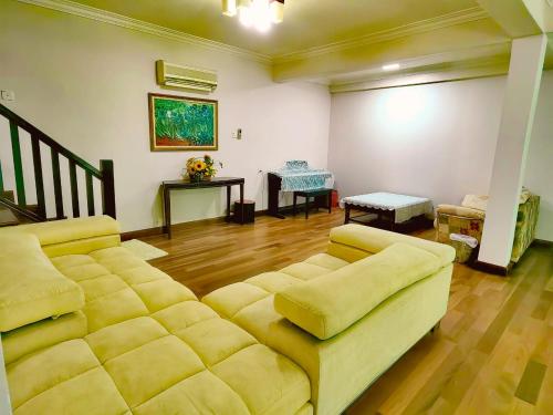 a living room with a couch and a table at AaronL Homestay in Kota Kinabalu