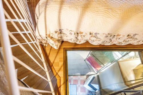 a window in a room with a curtain on it at Le Pigeonnier - Piscine - Jardin - Calme in Labastide-de-Lévis