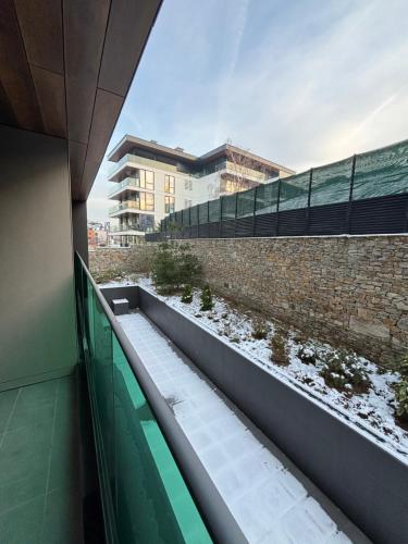 a balcony of a building with snow on the ground at Anna-Sofia apartment in Sofia