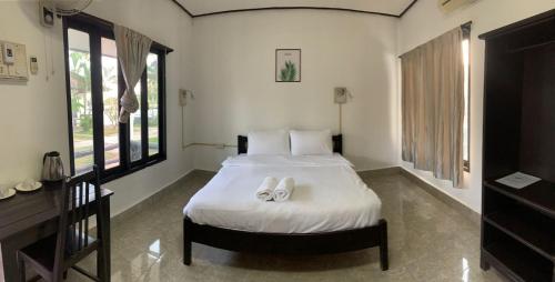 Łóżko lub łóżka w pokoju w obiekcie Diamond Villa Vang Vieng