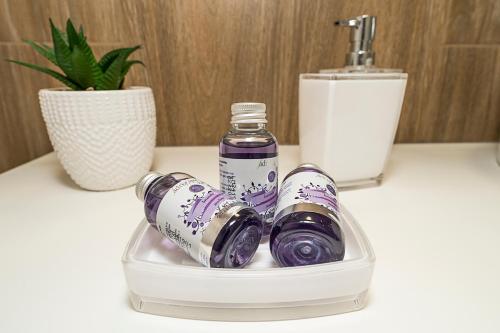 a plastic container with two bottles on a counter at Studio apartments Marcel in Split
