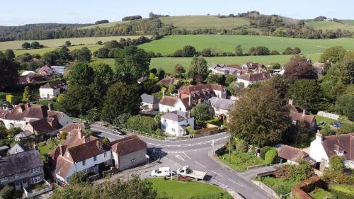 an aerial view of a small village with a winding road at Bridge House in Chichester