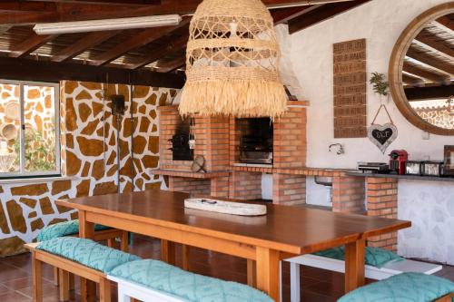 a dining room with a wooden table and chairs at NorthSpot in Nazaré