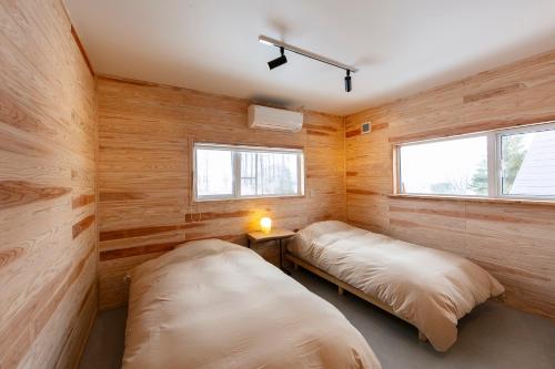 Ένα ή περισσότερα κρεβάτια σε δωμάτιο στο 2023 Open 【Lake Toya】IWANKE
