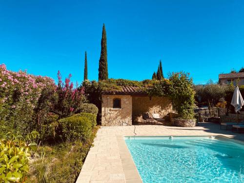 a house with a swimming pool in a yard at La Bastide des Oliviers Provence - Mirabel aux Baronnies in Mirabel-aux-Baronnies