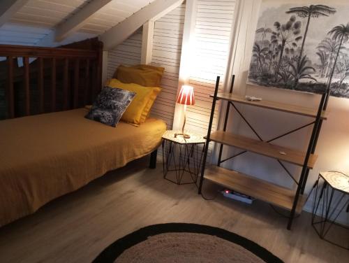 Ένα ή περισσότερα κρεβάτια σε δωμάτιο στο Bungalow Broceliande