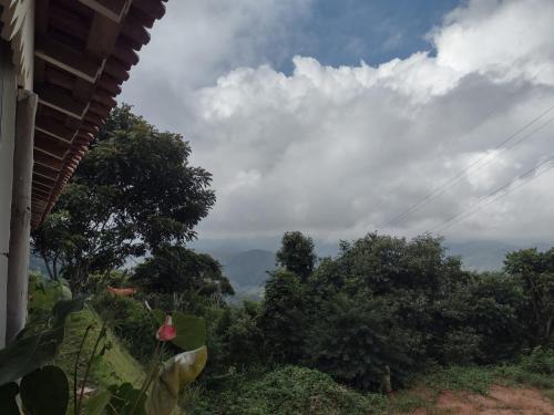 a view from a house with trees in the background at Sítio Werly in Domingos Martins