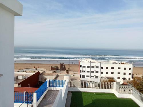 a view of the beach from the balcony of a building at MEHDIA PLAYA in Kenitra