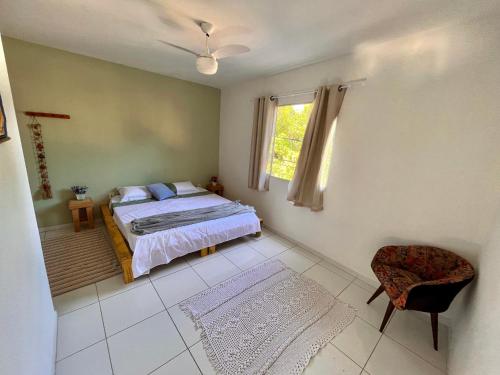 A bed or beds in a room at Kitnet na Vila de Manguinhos