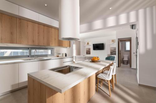 a kitchen with a sink and a counter top at Martini Villas in Kremasti