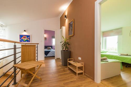 a living room with a staircase and a bedroom at Villa May mit privatem Pool in Porec,Istrien in Bašići