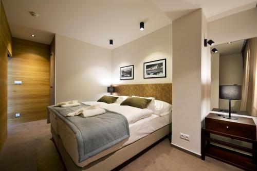 Postel nebo postele na pokoji v ubytování Hotel Lesna – Adult Friendly