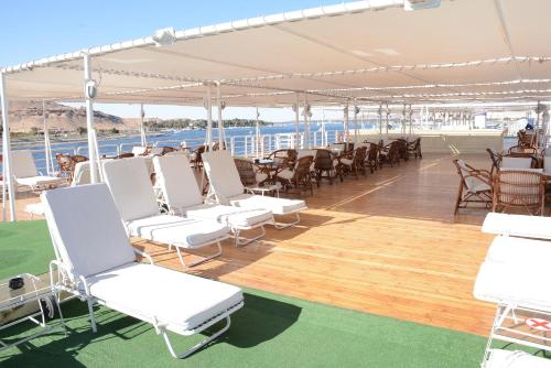 a deck of a cruise ship with white chairs and tables at GTS Nile Cruise Luxor Aswan every monday from Luxor friday from Aswan in Luxor