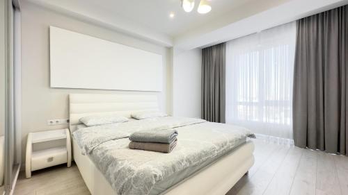 Ένα ή περισσότερα κρεβάτια σε δωμάτιο στο Tourist Grand Ismail Apartments