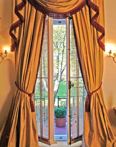 a window with curtains in front of a door at Twenty Nevern Square Hotel in London