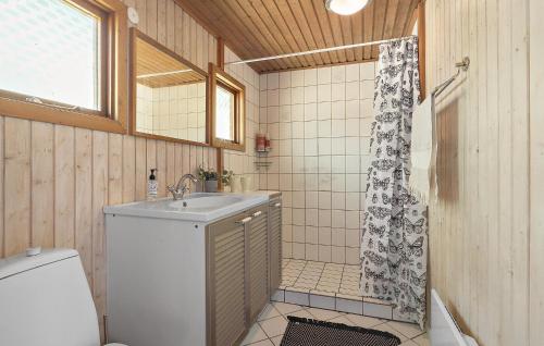 a bathroom with a sink and a shower curtain at Beautiful Home In Gilleleje With Wifi in Gilleleje