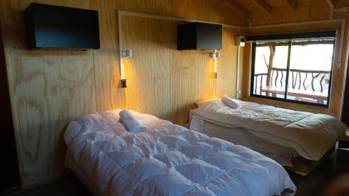 Tempat tidur dalam kamar di Hostal Central Panguipulli