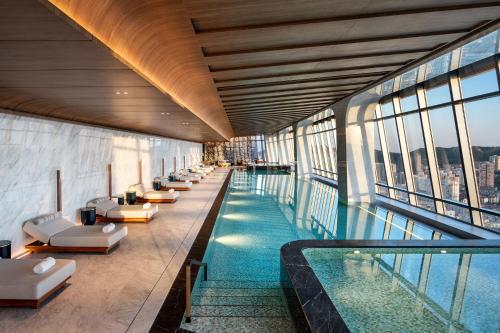 a swimming pool on the top of a building at Four Seasons Hotel Dalian in Dalian