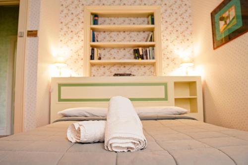 a bedroom with two beds with towels on it at Al centro Luxury Home in Caserta
