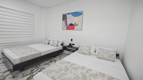 Voodi või voodid majutusasutuse ZAFIRO HOTEL toas