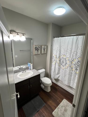 a bathroom with a sink and a toilet and a shower at Masterkeys Rentals LLC in Indianapolis