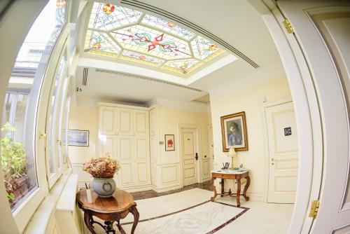 an arched hallway with a stained glass ceiling at Al centro Luxury Home in Caserta