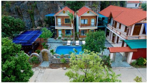an aerial view of a house with a swimming pool at Tam Coc Green Mountain Homestay in Ninh Binh