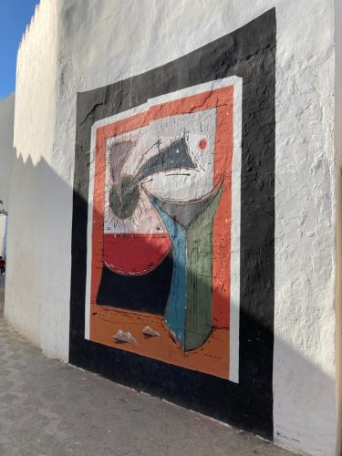 a painting on the side of a wall at Dar Said in Asilah