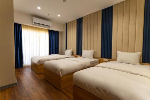 מיטה או מיטות בחדר ב-Havana View hotel