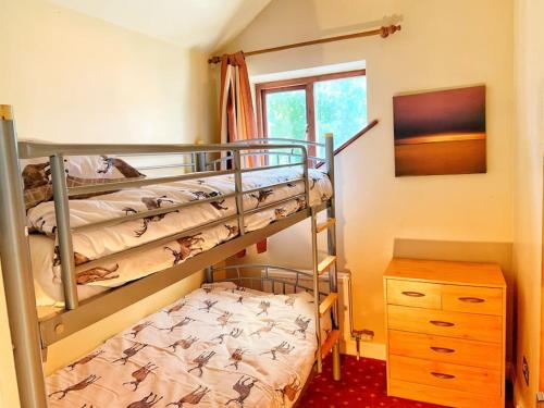 Cama o camas de una habitación en Stunning Barn Conversion in Heart of the Cotswolds