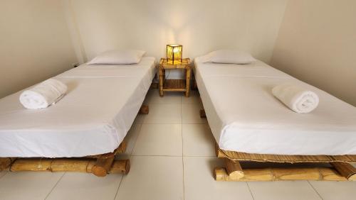 Postel nebo postele na pokoji v ubytování Kinti Guest House