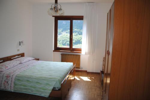 En eller flere senge i et værelse på Appartamento da Bruna e Manuela