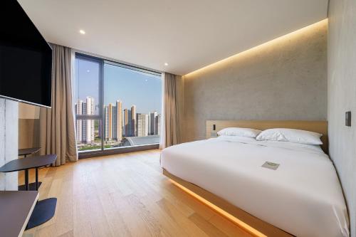 Postel nebo postele na pokoji v ubytování Take Hotel Seoul Gwangmyeong