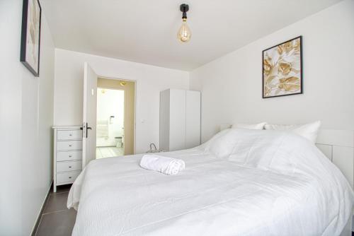 Llit o llits en una habitació de Cocon moderne - proche Disneyland Paris