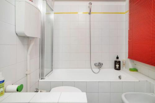 a bathroom with a shower and a toilet and a sink at Lovely Private Room in Milan