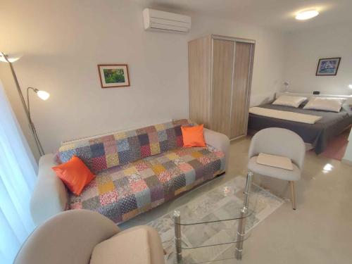 a living room with a couch and a bed at Studio in Siofok - Balaton 45328 in Siófok