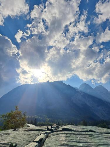 a view of a mountain under a cloudy sky at Prentnergut in Hinterstoder
