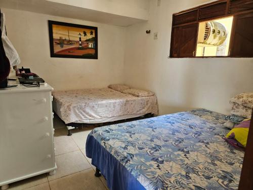 Posteľ alebo postele v izbe v ubytovaní Casa na Praia de Barreta com Wifi, Piscina e um Linda Vista do Mar