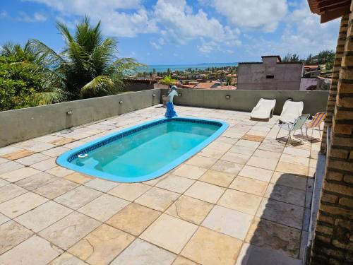 Bazén v ubytovaní Casa na Praia de Barreta com Wifi, Piscina e um Linda Vista do Mar alebo v jeho blízkosti