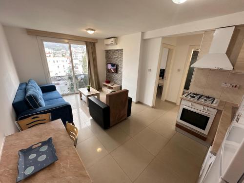 a kitchen and living room with a couch and a stove at Kyrenia center, 2 bedroom, 1 living room, residential apartment in Kérynia