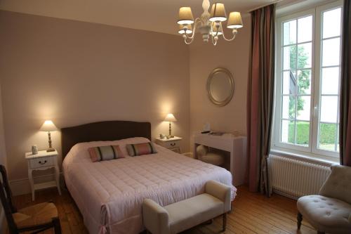 מיטה או מיטות בחדר ב-La Bertonnerie en Champagne