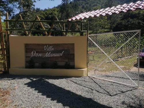 a sign that says wildooramed in front of a fence at Villa Don Manuel in Villa Altagracia