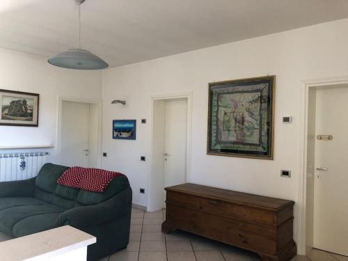 a living room with a couch and a table at SistersHome in Cervia
