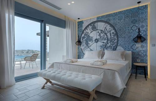 a bedroom with a large clock on the wall at Artisan's House in Sitia