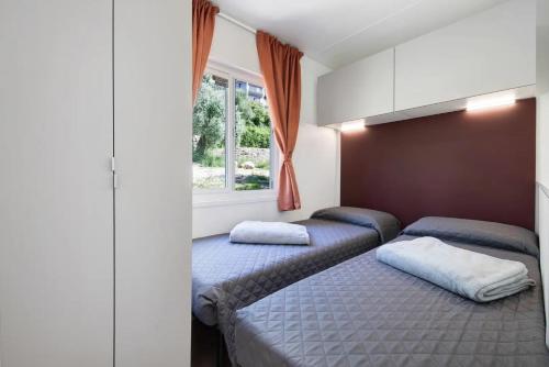 Katil atau katil-katil dalam bilik di Camping Eurovil