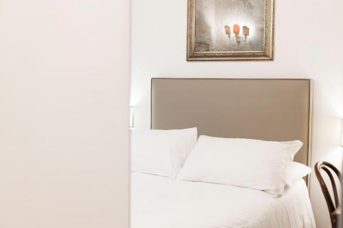 Postel nebo postele na pokoji v ubytování Domus Vitra