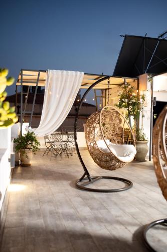 a group of chairs sitting on top of a roof at Ziolì in Noto