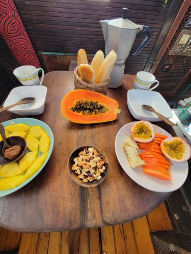 a wooden table with plates of food on it at sanblasonsailboats in El Porvenir