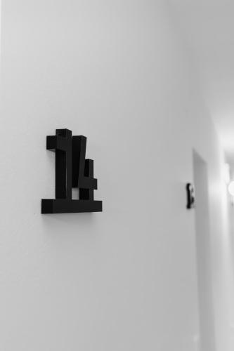 a black object on a wall with numbers on it at GUESTHOUSE RIEGERSBURG - Das Haus der guten Geister in Riegersburg